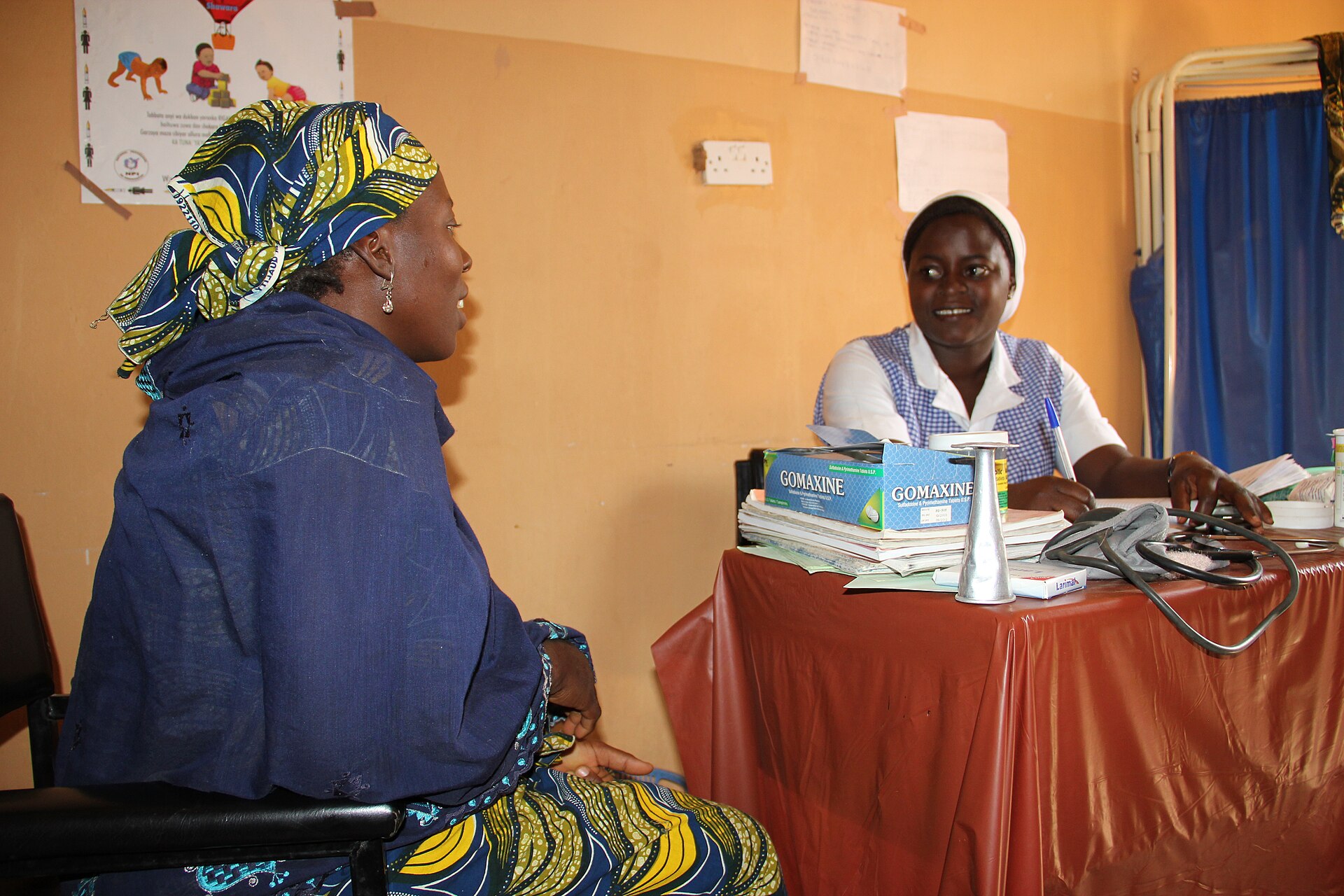 Health worker consulting with a patient at a primary health care centre